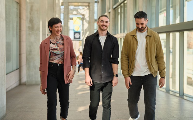 Group of visitors walking up the NGC Great Hall ramp.