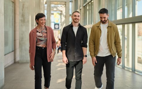 Group of visitors walking up the NGC Great Hall ramp.