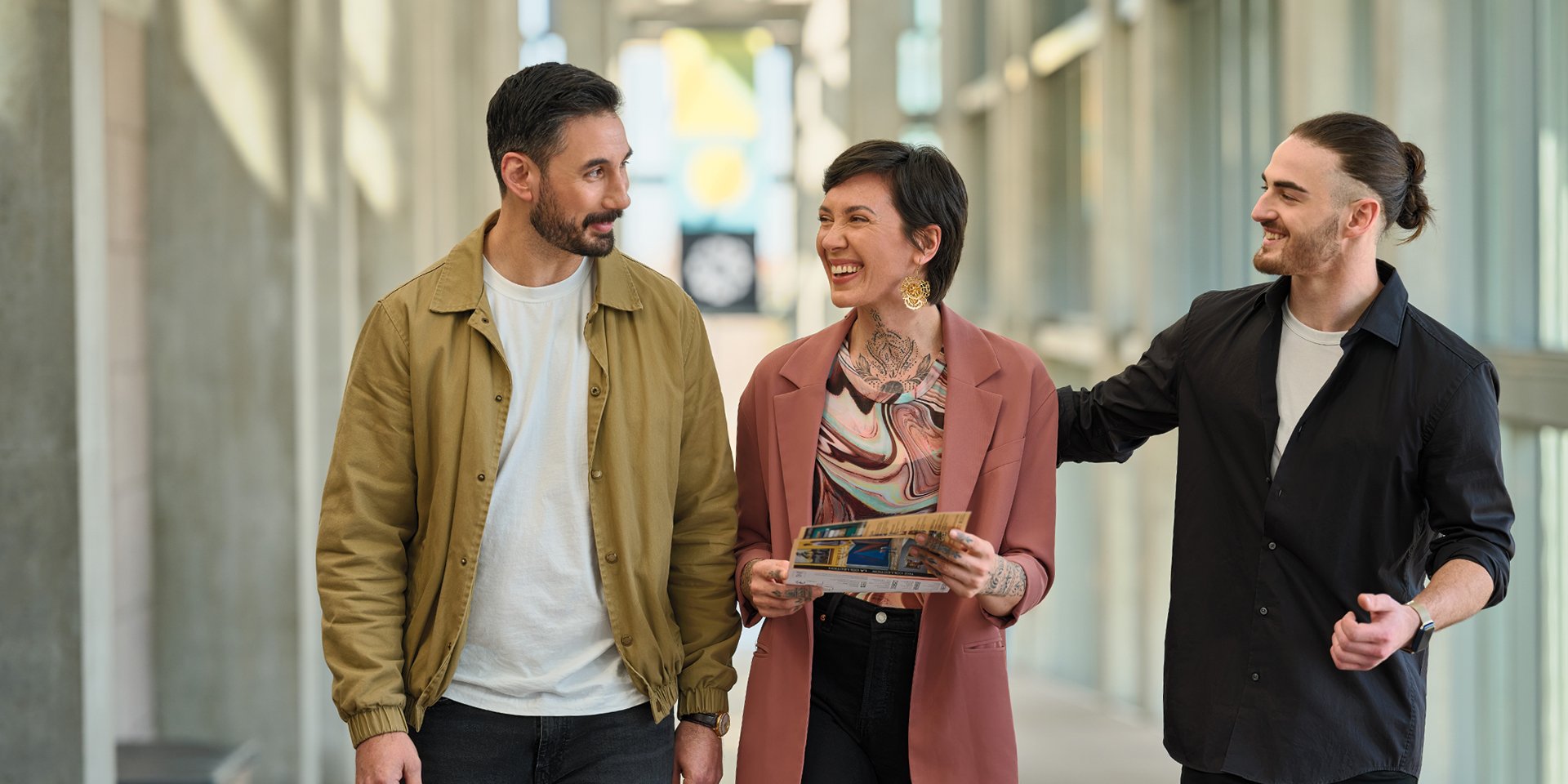Group of visitors walking up the NGC Great Hall ramp.