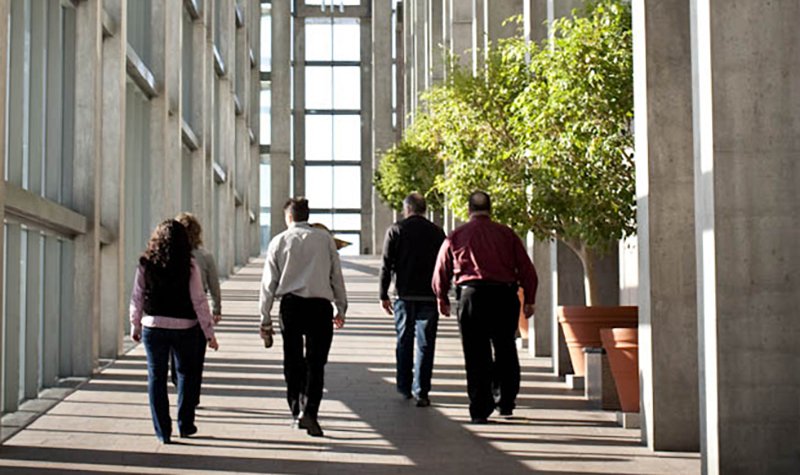 A group of people walking towards the Scotiabank Great Hall
